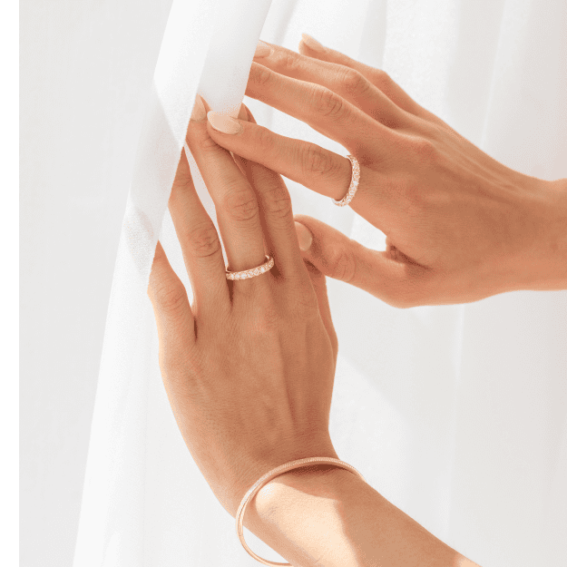 Hands wearing David Von rings and a bangle